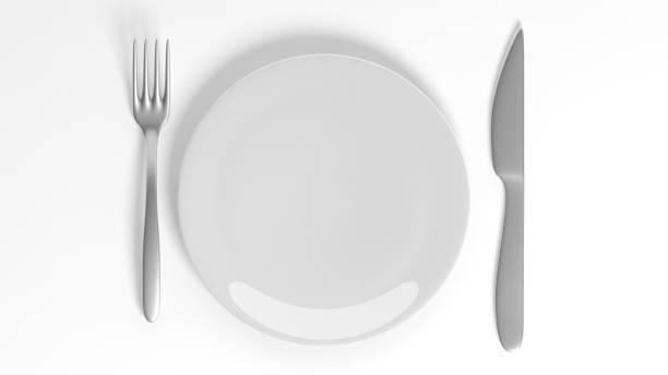 istock Silver fork and knife with a plate, isolated on white background. 1015864094