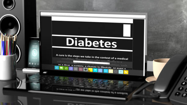 istock Laptop with Diabetes information on screen, on desktop with office objects. 1015867590