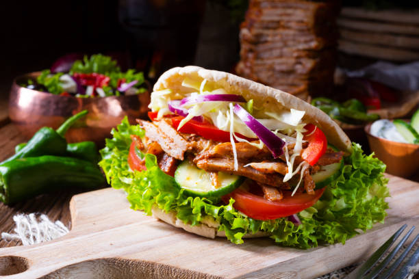 crunchy pita with grilled gyros meat. various vegetables and garlic sauce - opa! souvlaki of greece imagens e fotografias de stock