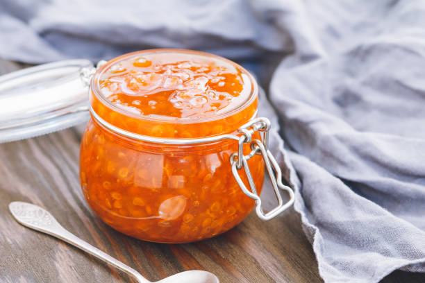 istock Glass jar with cloudberry jam. Nordic cuisine. 1015868326