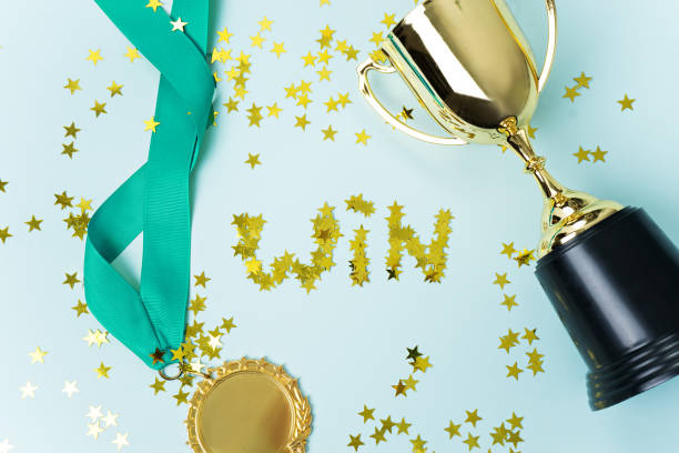 istock gold medal and cup on blue  background 1015887018