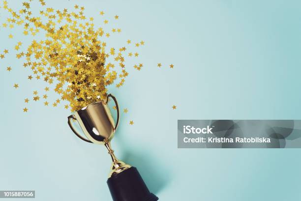 Gold Winner Cup On Blue Background Stock Photo - Download Image Now - Winning, Award, Success