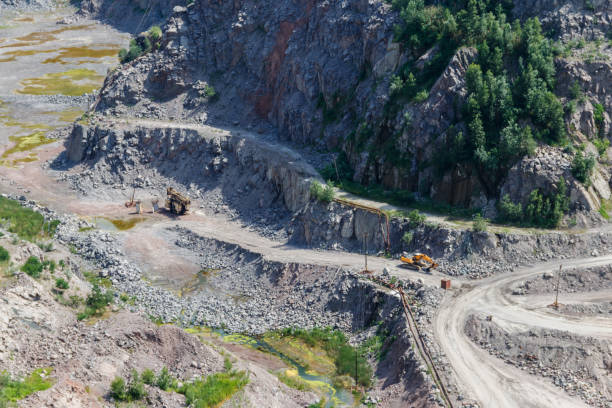 istock Extraction of mineral resources in the granite quarry 1015894210