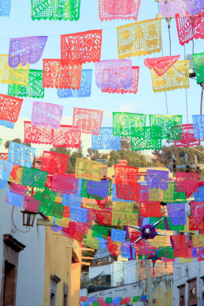 istock Multicolored Mexican Suspended Street Flags and Decorations 1015902798