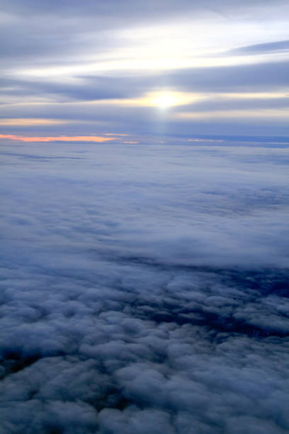 istock High Altitude Sunset over the Clouds from a Plane Window 1015903746