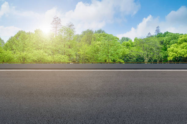 istock Empty highway asphalt road and beautiful sky landscape and forest 1015913402