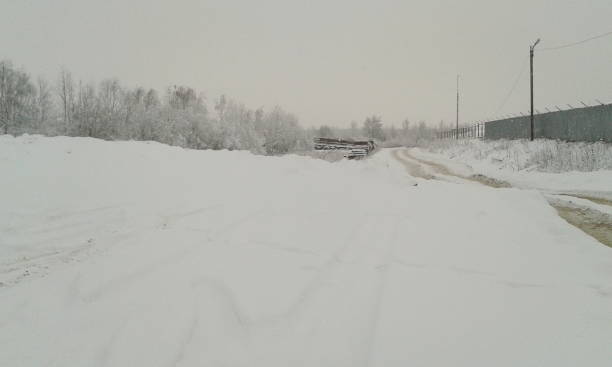 istock road in the snow on a winter day 1015914110