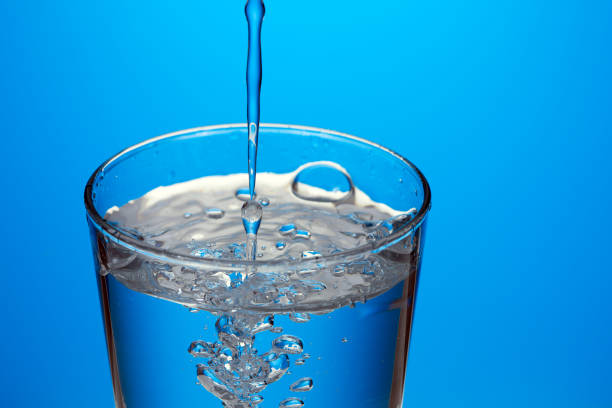 istock Beautiful splash of blue water 1015921678