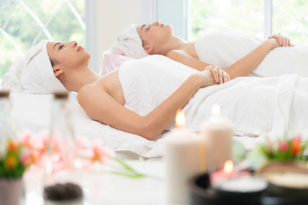 istock Relaxed young woman lying on spa bed for massage. 1015927230