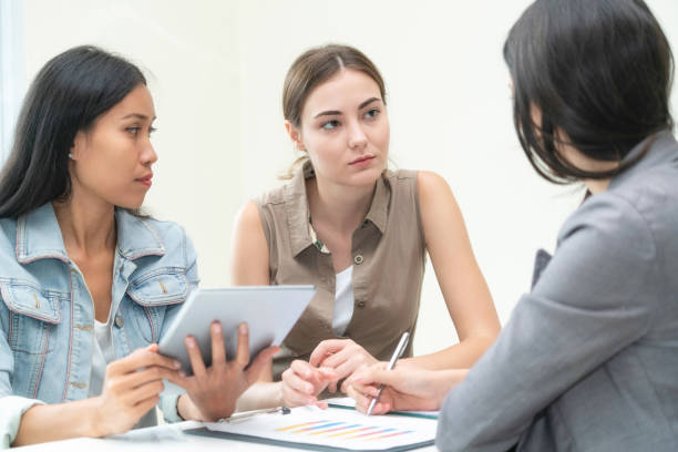 istock Multicultural businesswomen in group meeting. 1015927640