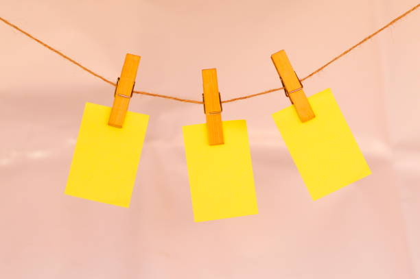 istock Blank sticky notes hanging with cloth pins on clothes line 1015927924