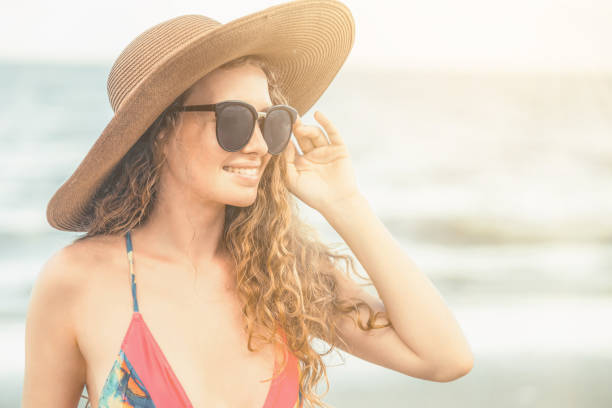 istock Happy young woman at beach in summer vacation. 1015932454