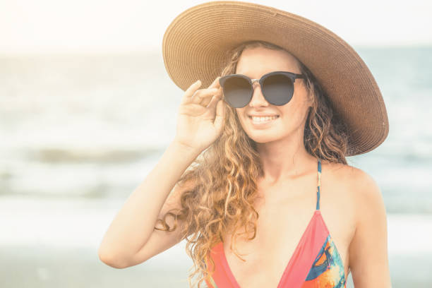 istock Happy young woman at beach in summer vacation. 1015932940