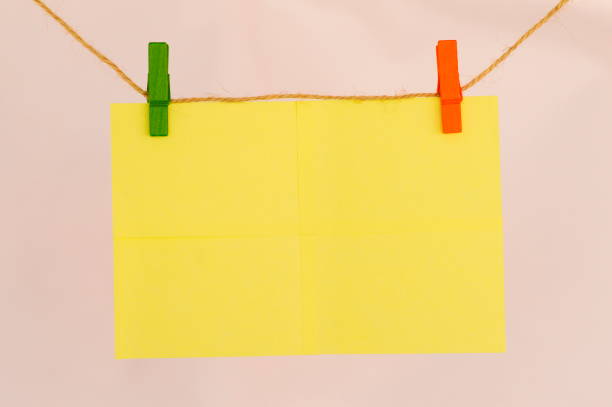 istock Blank sticky notes hanging with cloth pins on clothes line 1015933506