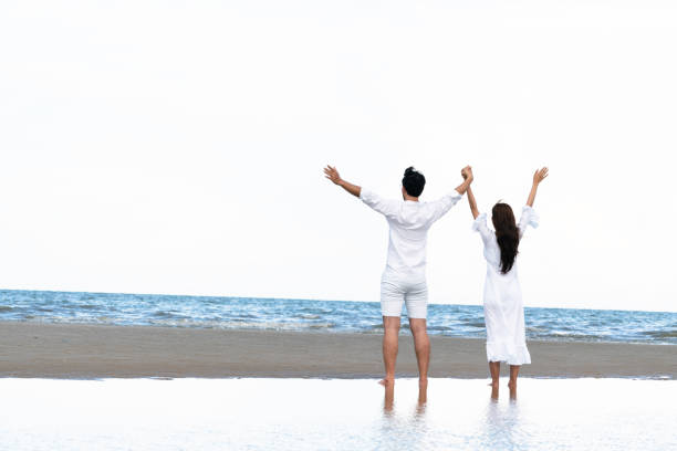 istock Couple going honeymoon on tropical beach in summer 1015934130