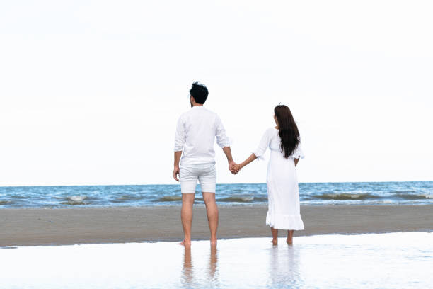 istock Couple going honeymoon on tropical beach in summer 1015934172