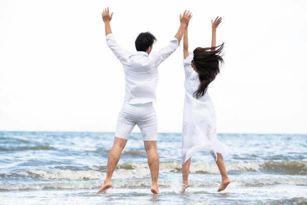 istock Couple going honeymoon on tropical beach in summer 1015934176