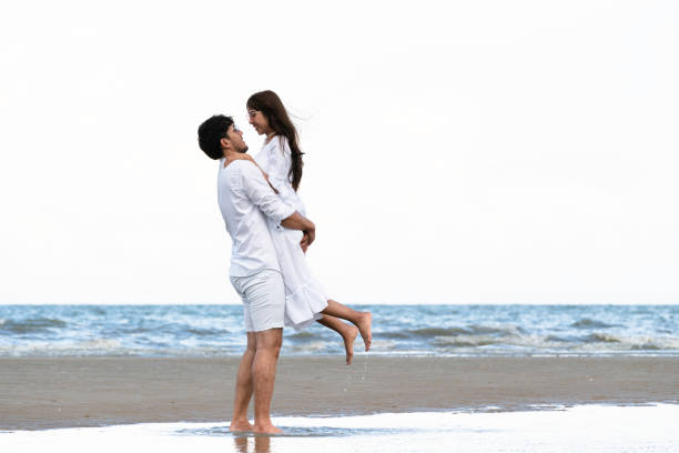istock Couple going honeymoon on tropical beach in summer 1015934180