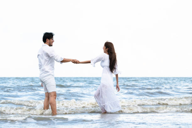 istock Couple going honeymoon on tropical beach in summer 1015934238
