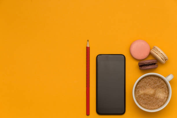 istock Coffee and French macaroons top view 1015934468