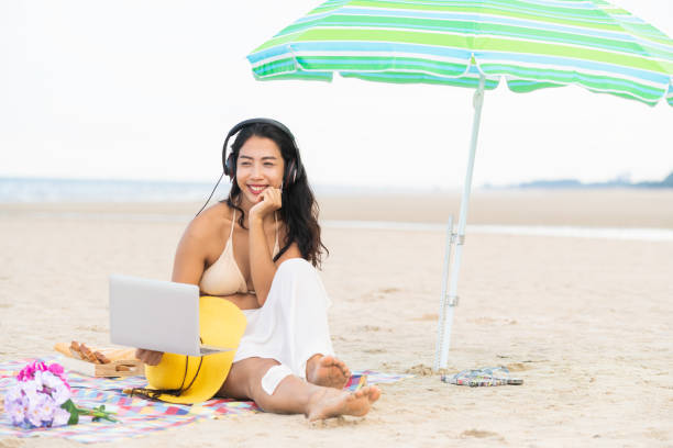 istock Plus size young woman sitting on the beach. 1015934676
