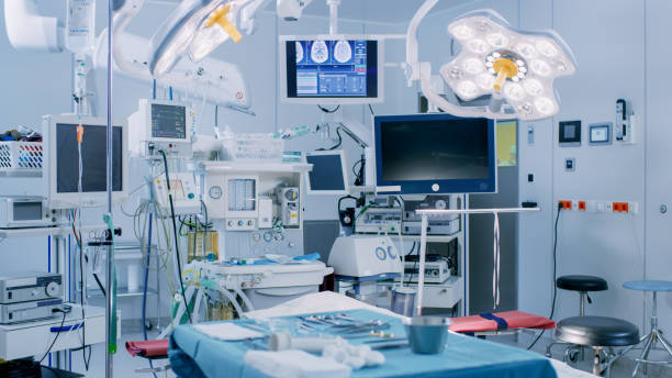 istock Establishing Shot of Technologically Advanced Operating Room with No People, Ready for Surgery. Real Modern Operating TheaterWith Working equipment,  Lights and Computers Ready for Surgeons and a Patients. 1015935006