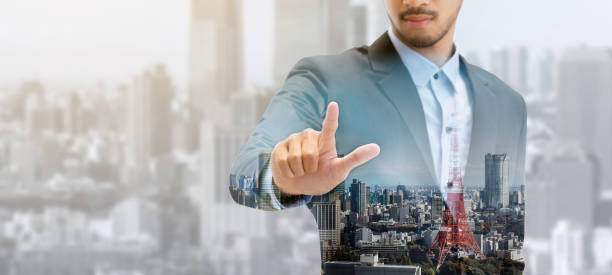 istock Double exposure businessman pointing at copy space 1015939090