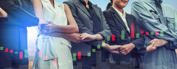 istock Double exposure business people holding hands. 1015941450