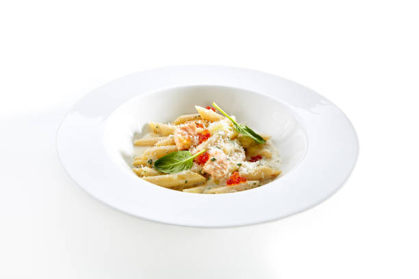 istock Fish Penne Pasta Al Dente with Salmon Isolated on White Background 1015942336