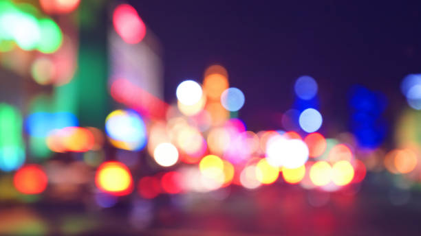 Blurred city lights at night, color toning applied. stock photo