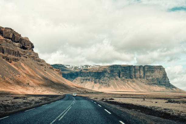 Empty asphalt road through the mountains in Iceland