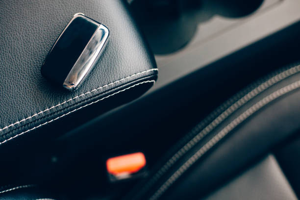 istock Car key over a car leather seat 1015957662