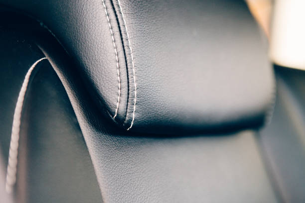 istock Car headrest in leather upholstery detail 1015957806