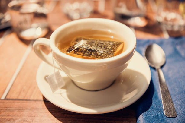 istock Green tea with mint, teacup and tea bag detail 1015958024