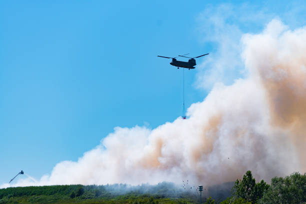 istock army chinook helicopter extinguishing a large fire 1015961452