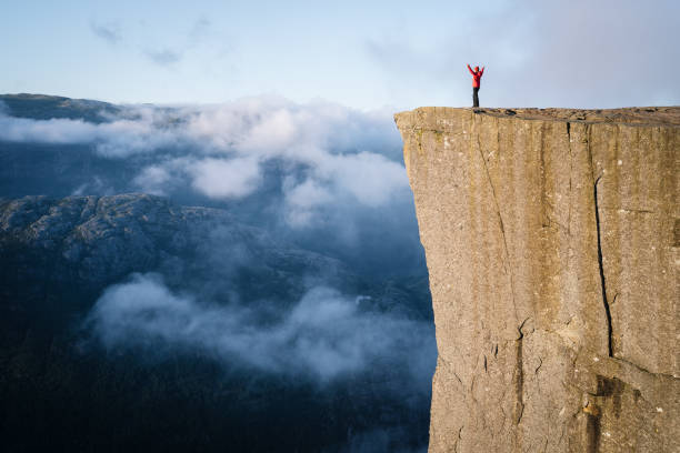 istock Girl on the Rock Preikestolen, Norway 1015961930