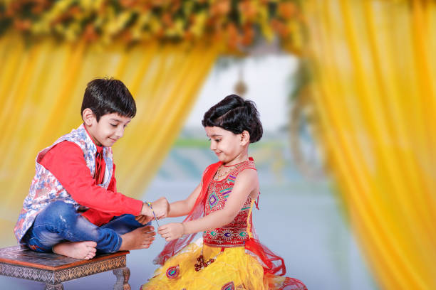 cute Indian brother and sister celebrating raksha bandhan festival , cute Indian brother and sister celebrating raksha bandhan festival , beautiful traditional indian girl stock pictures, royalty-free photos & images