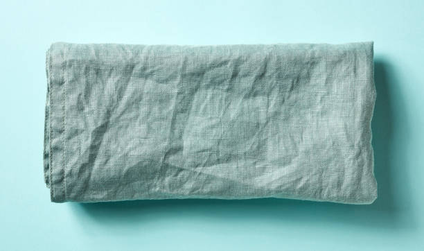 istock Cotton napkin on blue, from above 1015975958