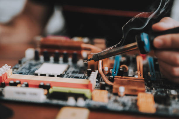 istock Close up. Young Man Repairing Motherboard from PC. 1015976110
