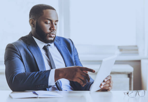 istock Young Beard Afro-american Man Working with Laptop. 1015989266