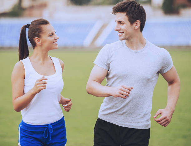 istock Young Happy Couple During Jogging in Morning. 1015989820