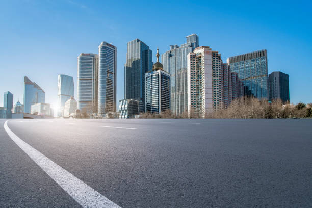 istock Qingdao modern construction commercial building office building with prospect highway asphalt pavement 1015995656
