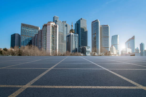 istock Qingdao modern construction commercial building office building with prospect highway asphalt pavement 1016001722