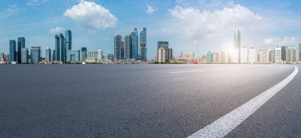 istock Qingdao modern construction commercial building office building with prospect highway asphalt pavement 1016005468