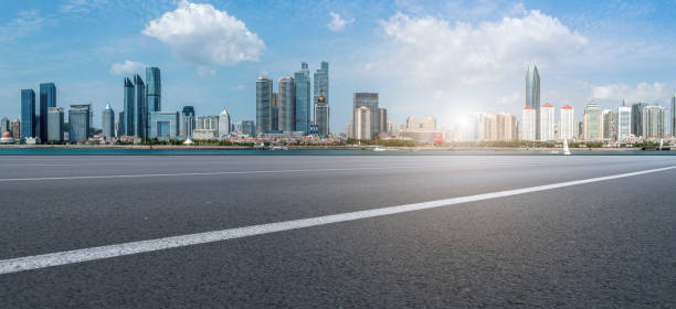 istock Qingdao modern construction commercial building office building with prospect highway asphalt pavement 1016005738