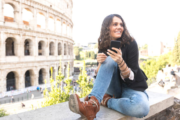 istock Tourist sitting in front of Coliseum, resting 1016013594