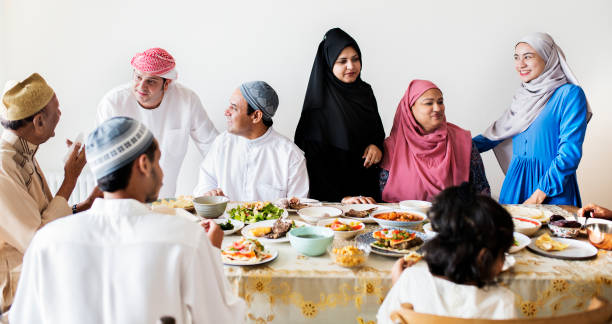 Muslim family having a Ramadan feast Muslim family having a Ramadan feast halal stock pictures, royalty-free photos & images