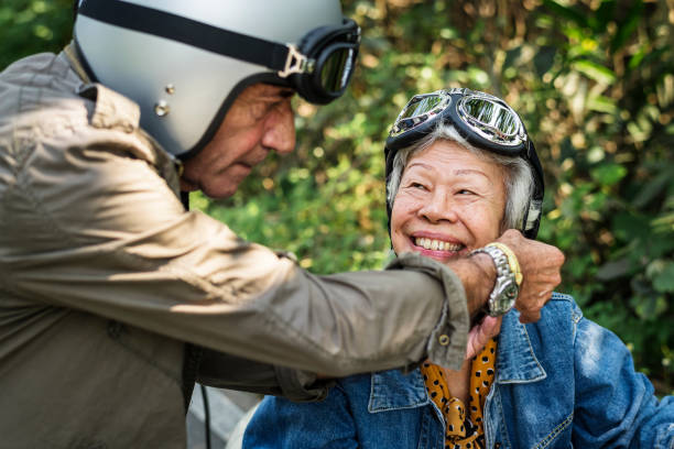 istock Senior couple riding a classic scooter 1016031648