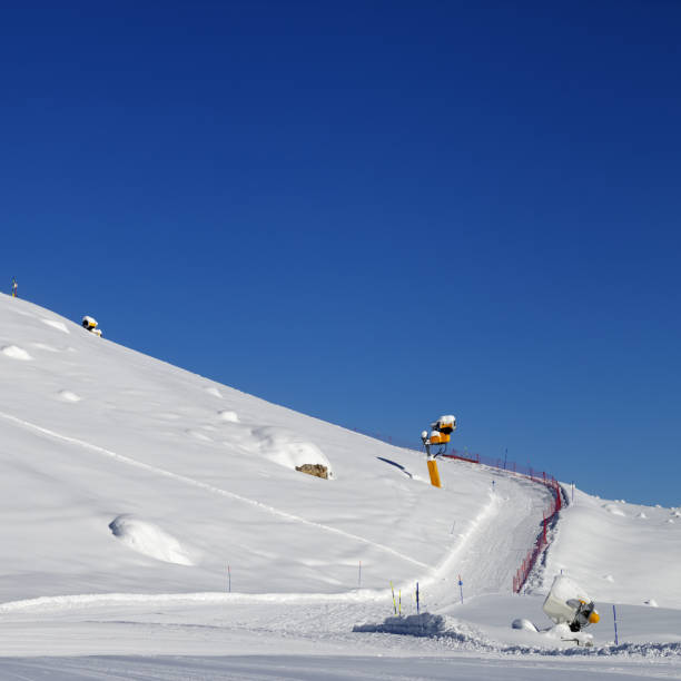 istock Ski slope with snowmaking at sun day 1016035152