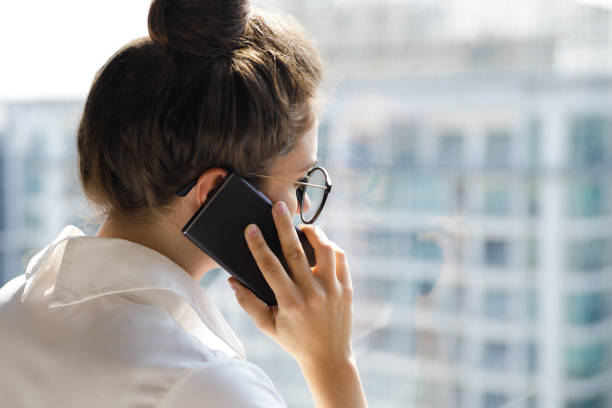 istock Young businesswoman using smartphone in her office 1016043356